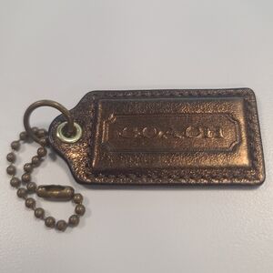 Bronze coach hang tag